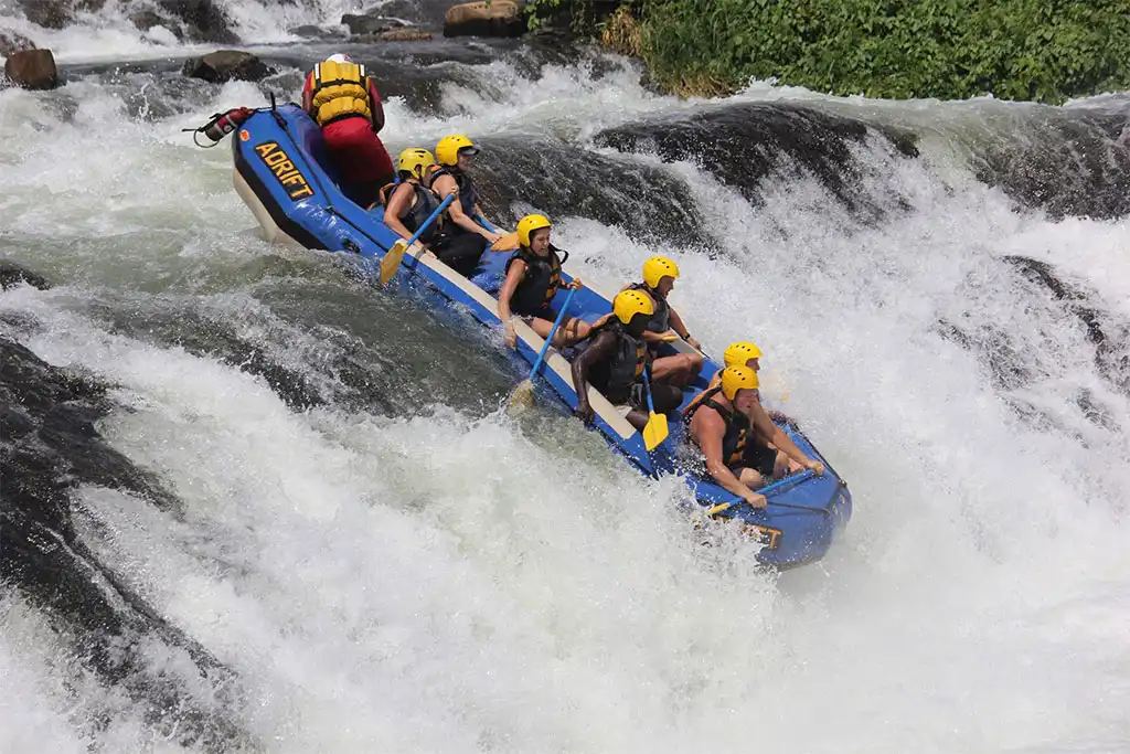 Rafters hitting a Grade 5 rapid on the Nile in Jinja
